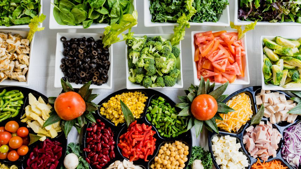 Top down view of colourful salad items
